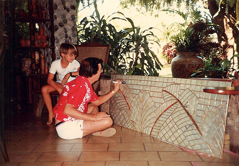 Gelo watching his father tinker with a glass panel, 1983 | Photo courtesy of Mañosa and Company