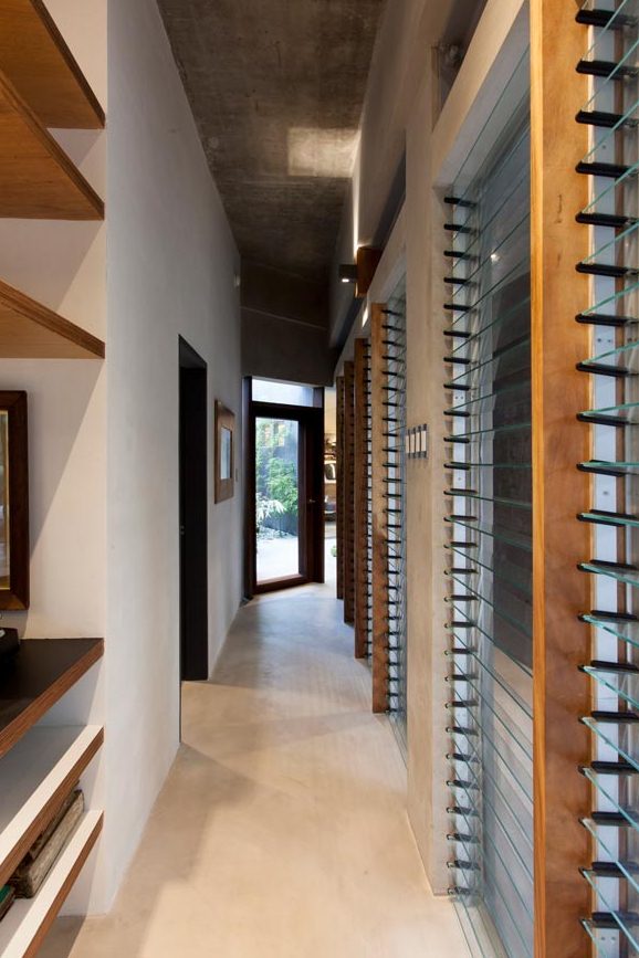 The entrance corridor is studded with glass jalousie windows