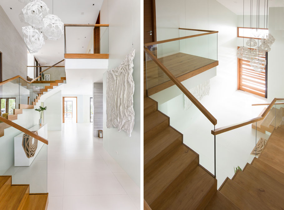 Heima Interiors masterfully indulged their client's pining for an immaculate white home with touches of warmth, except some surfaces aren't really white, but a shade called "Drizzle Blue." Walls washed with the delicate tint (for example, those underneath and opposite the staircase) keep the antiseptic hospital feel at bay while maintaining a clean, bright look. The art piece by Nikki Luna adds texture to the silken space.