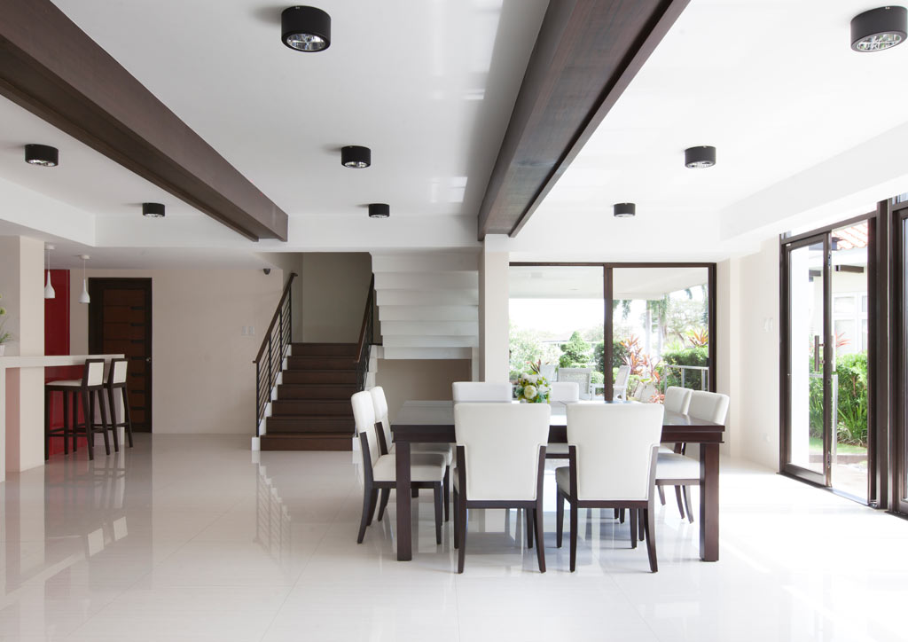 The ground floor (which includes the living room, dining room, and kitchen) follows an open plan and allows the air to flow from operable doors and windows located on all sides.