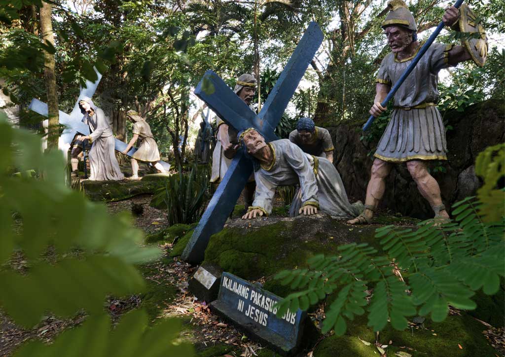 14 larger than life Stations of the Cross run along the left perimeter wall of the Batangas church's grounds.