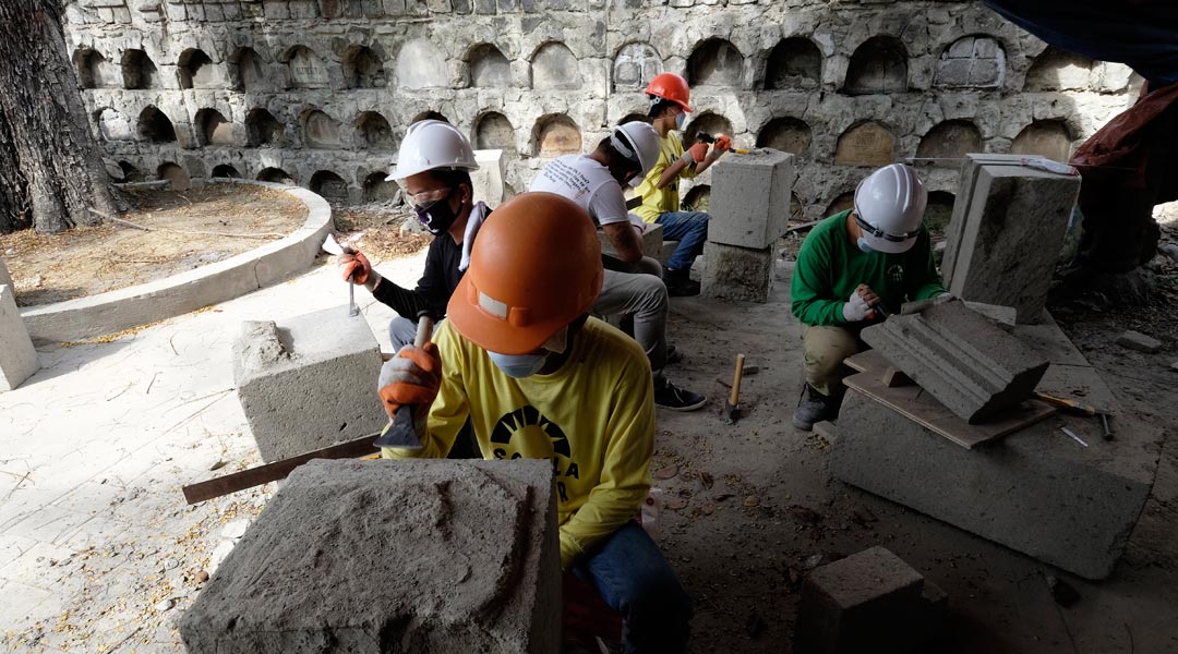 Paco Park The Escuela Taller team fashions adobe blocks and cornices to replace the compromised elements in the ossuary. The masons work manually because grinding machines will make the area too dusty and also to replicate the original 19th century stones as best as they can.