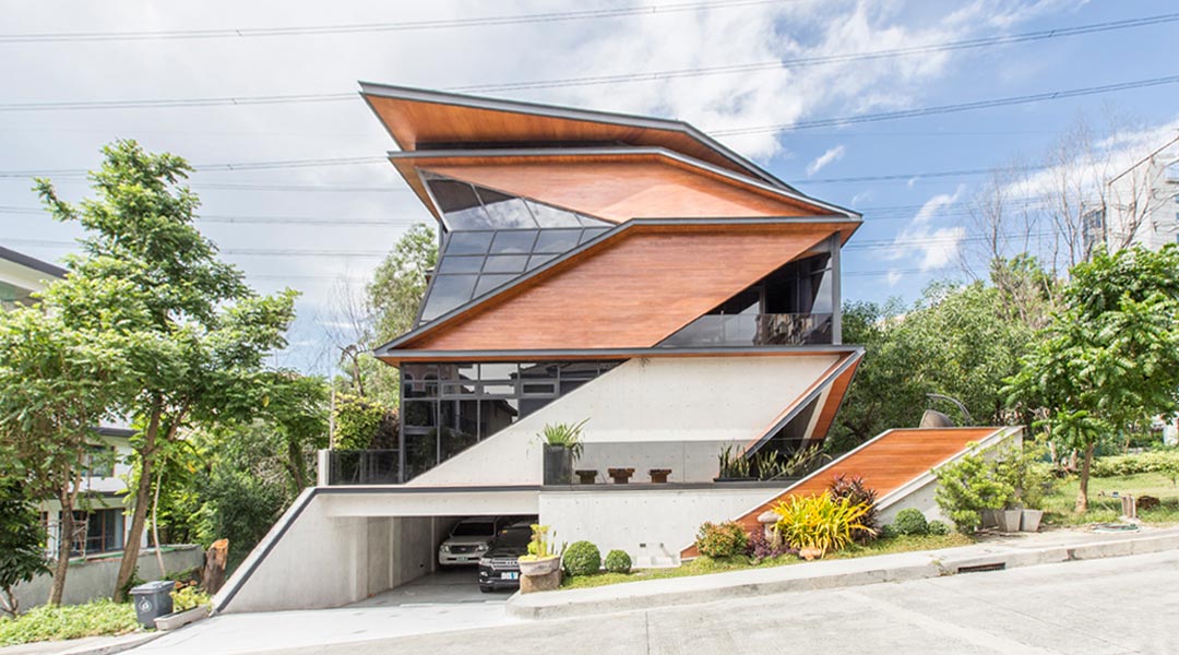 Buensalido likens the Polygon House to a bahay na bato construction. While steel framing was used for the three upper floors, the lower ground floor was made with poured concrete for a heavy base and in case of flooding. Because the lots in the village range from 200 to 300 square meters only, the 13-meter height restriction is higher compared to most villages. Cement fiber boards painted to look like wood were used for the solid portions of the facade.