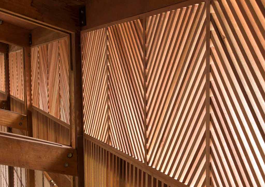 Diagonal wooden slats make up the walls of an emergency services center.