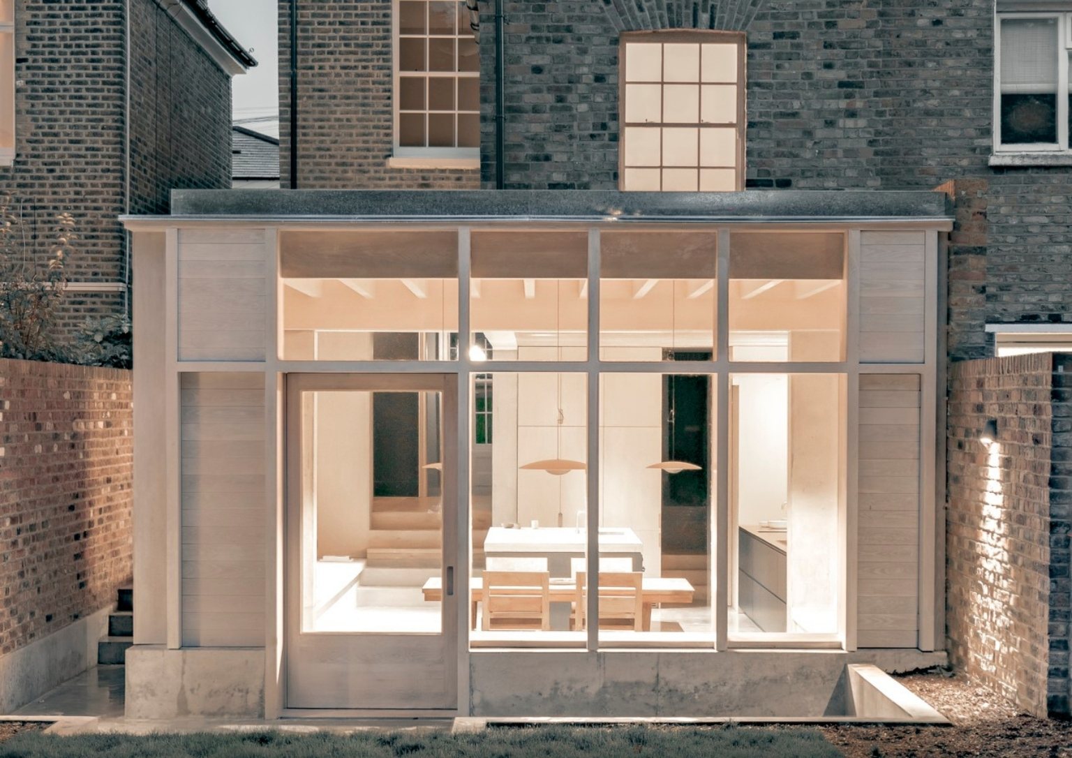 exterior view of modern home extension with a dining and kitchen area