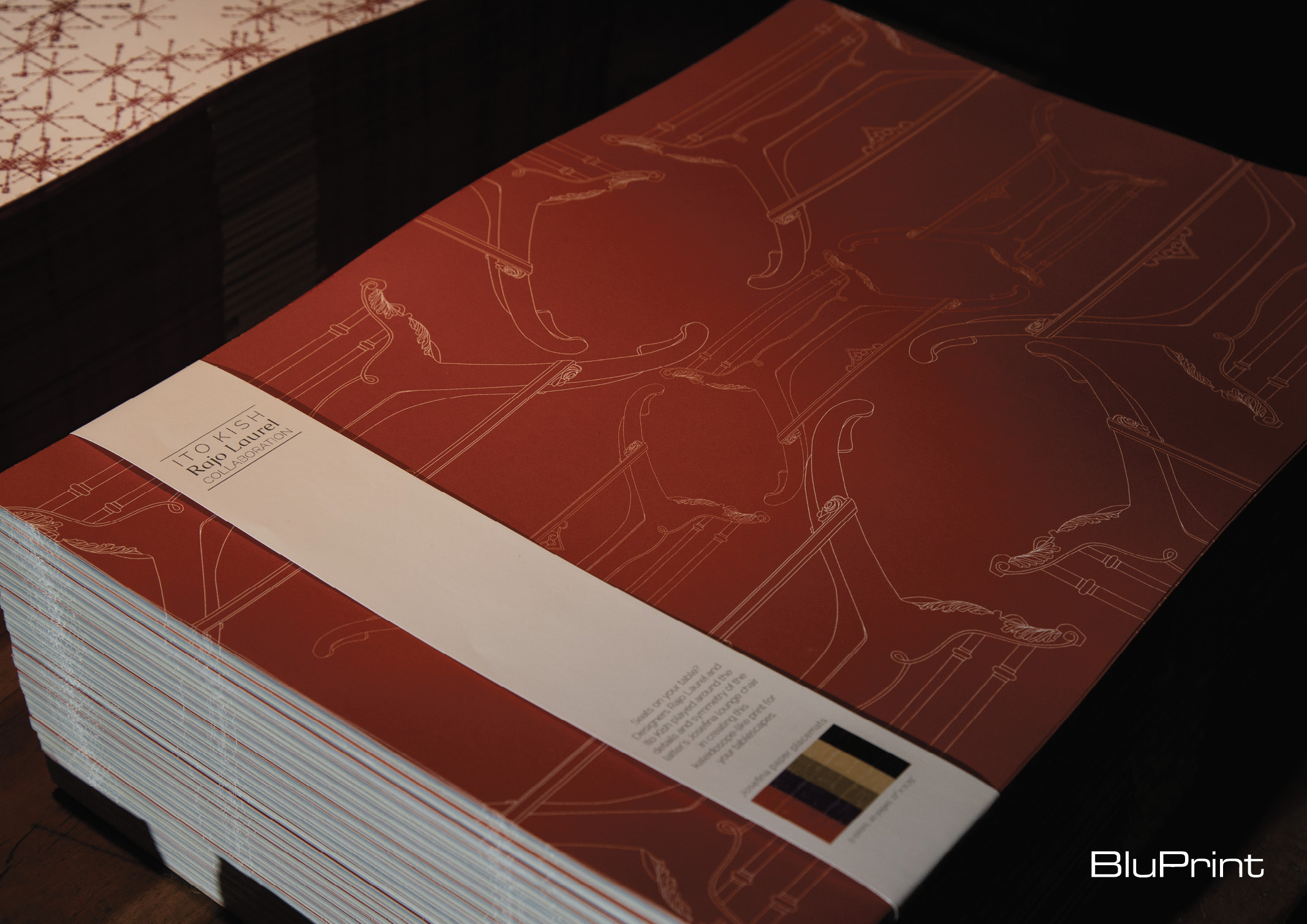 red paper placemats with Filipino motifs designed by Ito Kish and Rajo Laurel