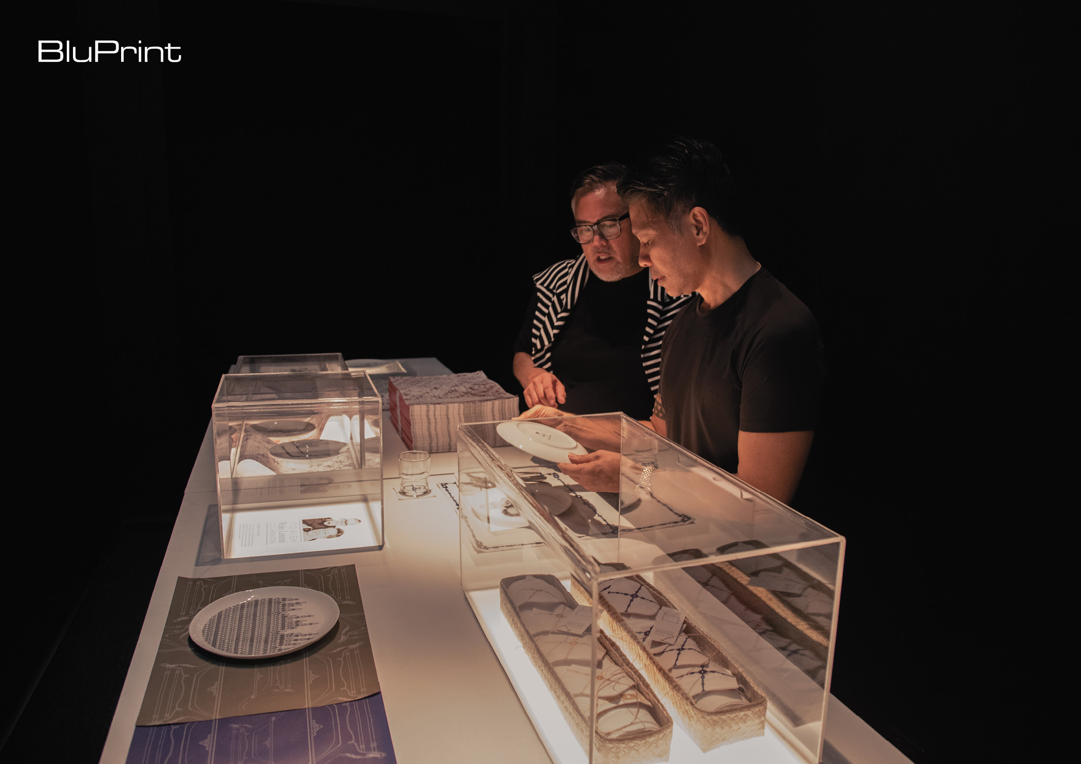 designers rajo laurel and ito kish examine pieces in their collection