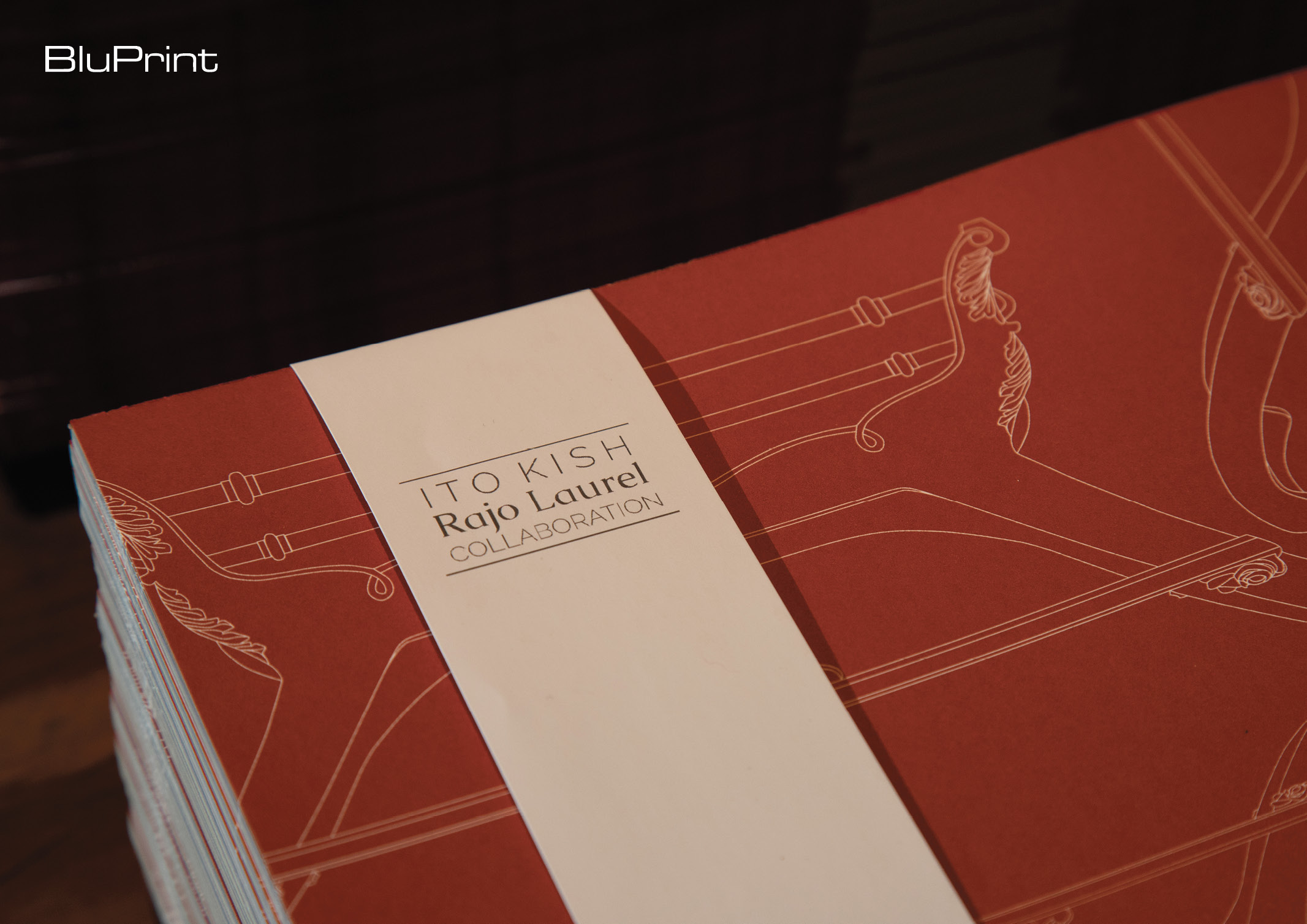 red paper placemats with Filipino motifs designed by Ito Kish and Rajo Laurel