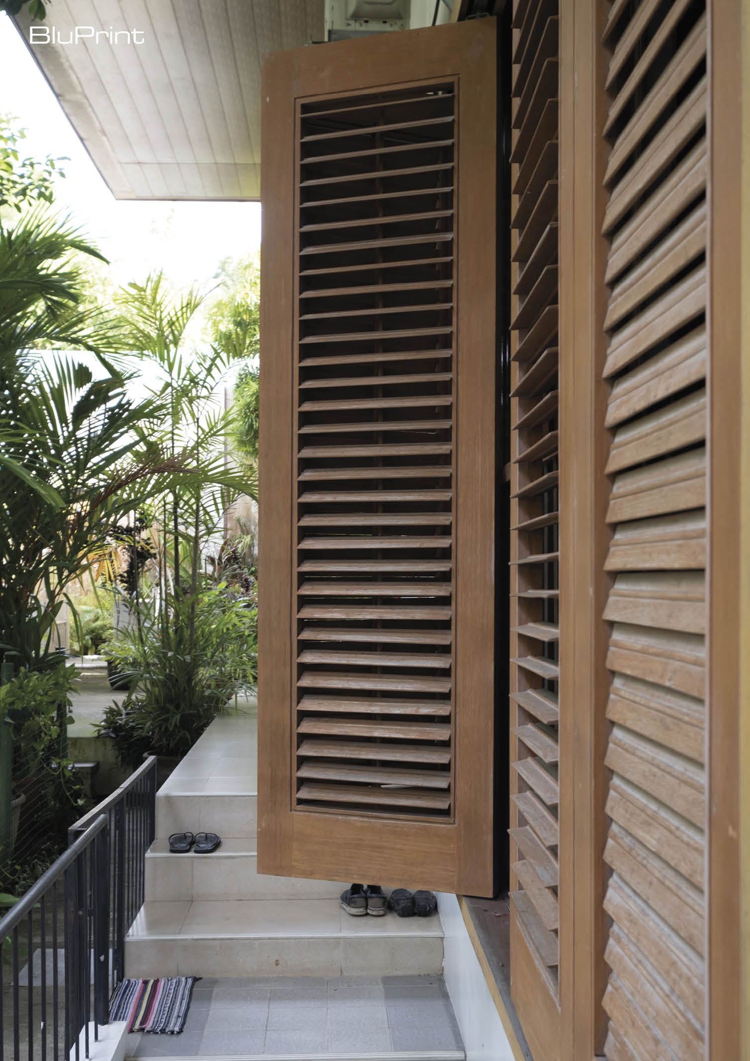 Slatted wooden window shutters