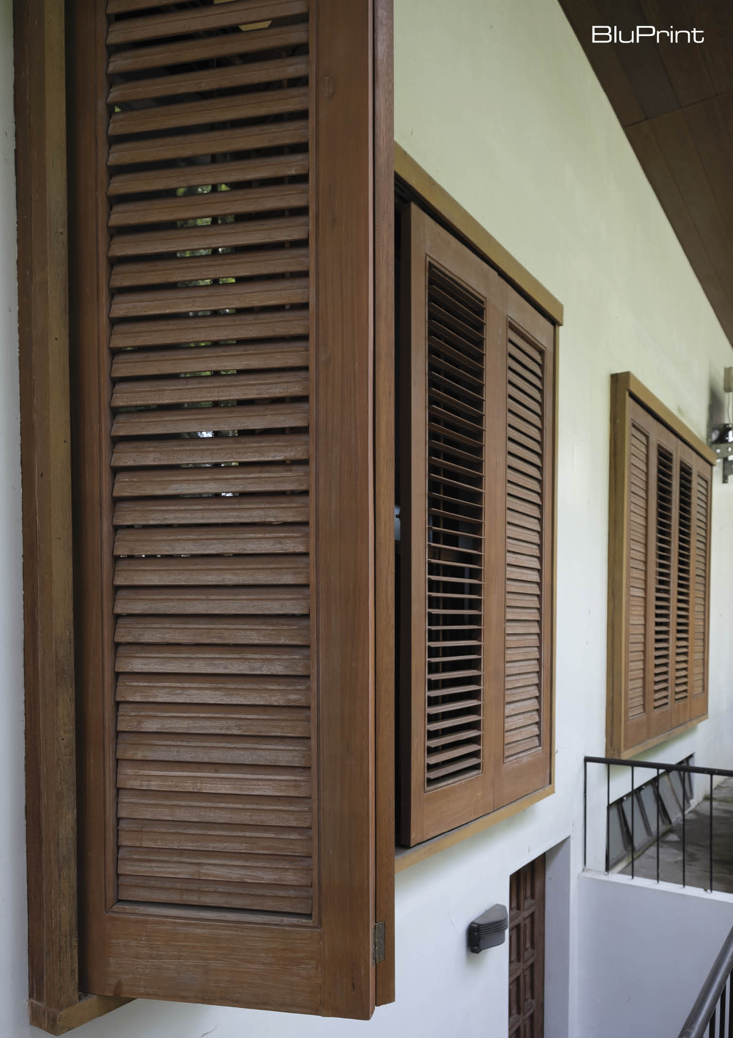 Slatted wooden window shutters