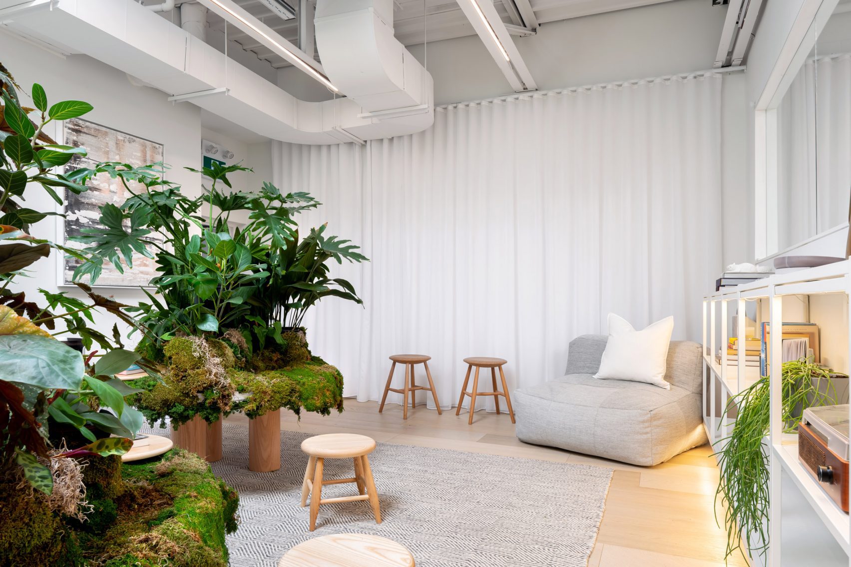 Mason Studio's lounge area with comfortable seating a light bright walls create a calm and relaxing space.