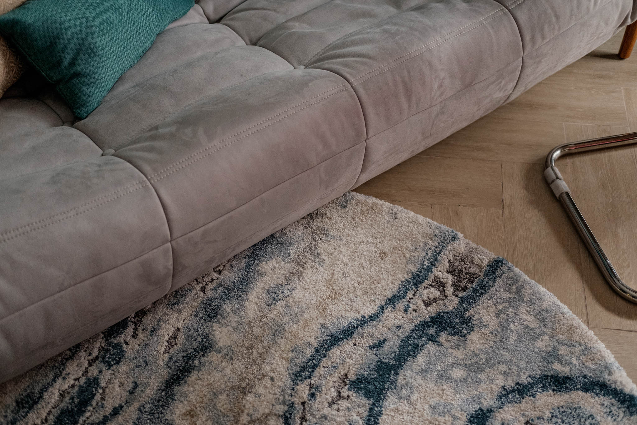 A custom marble-like rug sits at the center