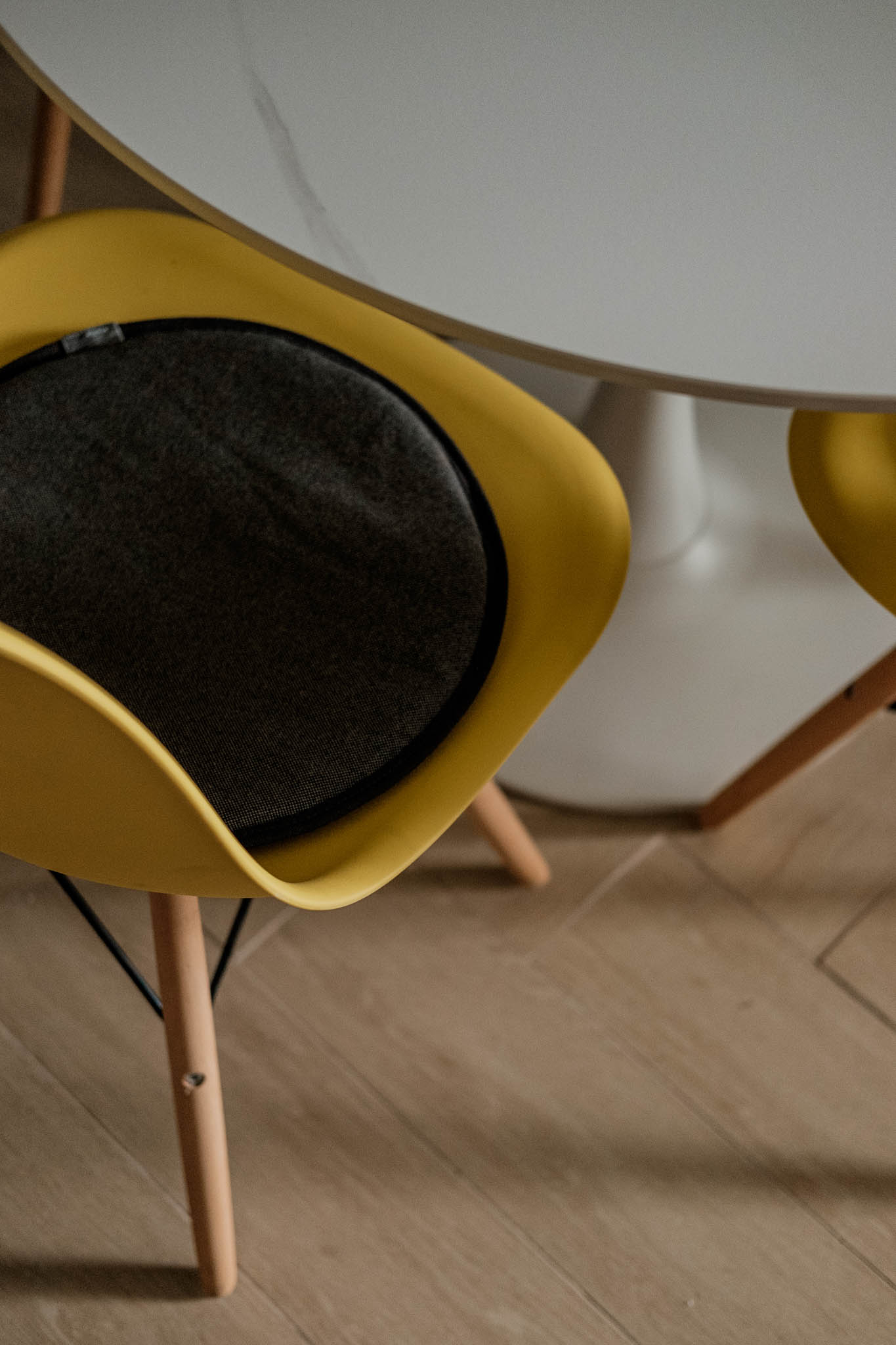 Eames-inspired yellow eggshell chair