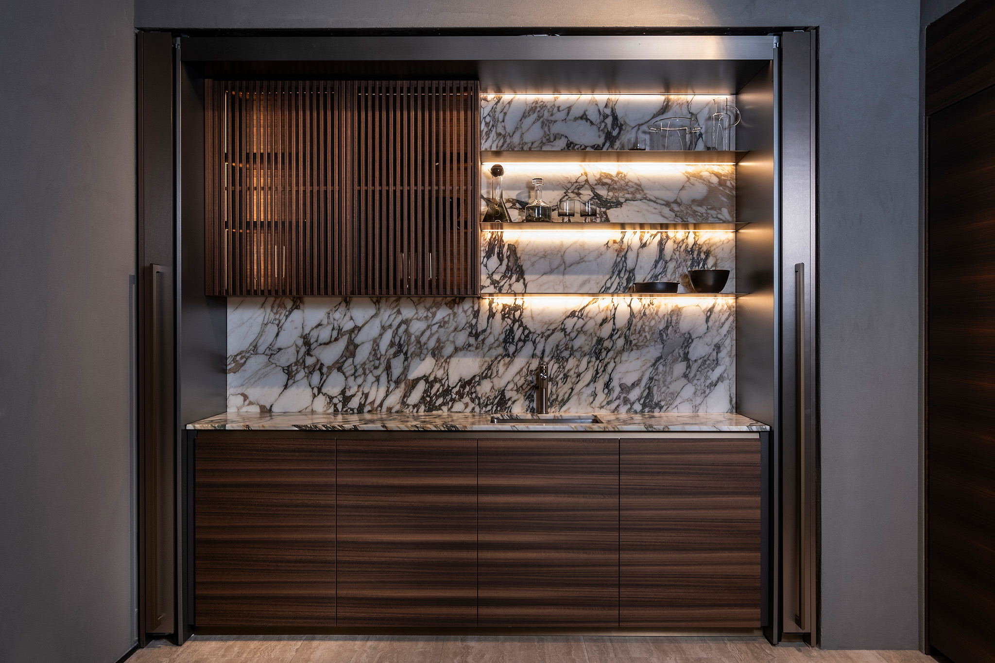 3 - BluPrint a luxurious kitchen with wooden cabinetry and marble backsplash