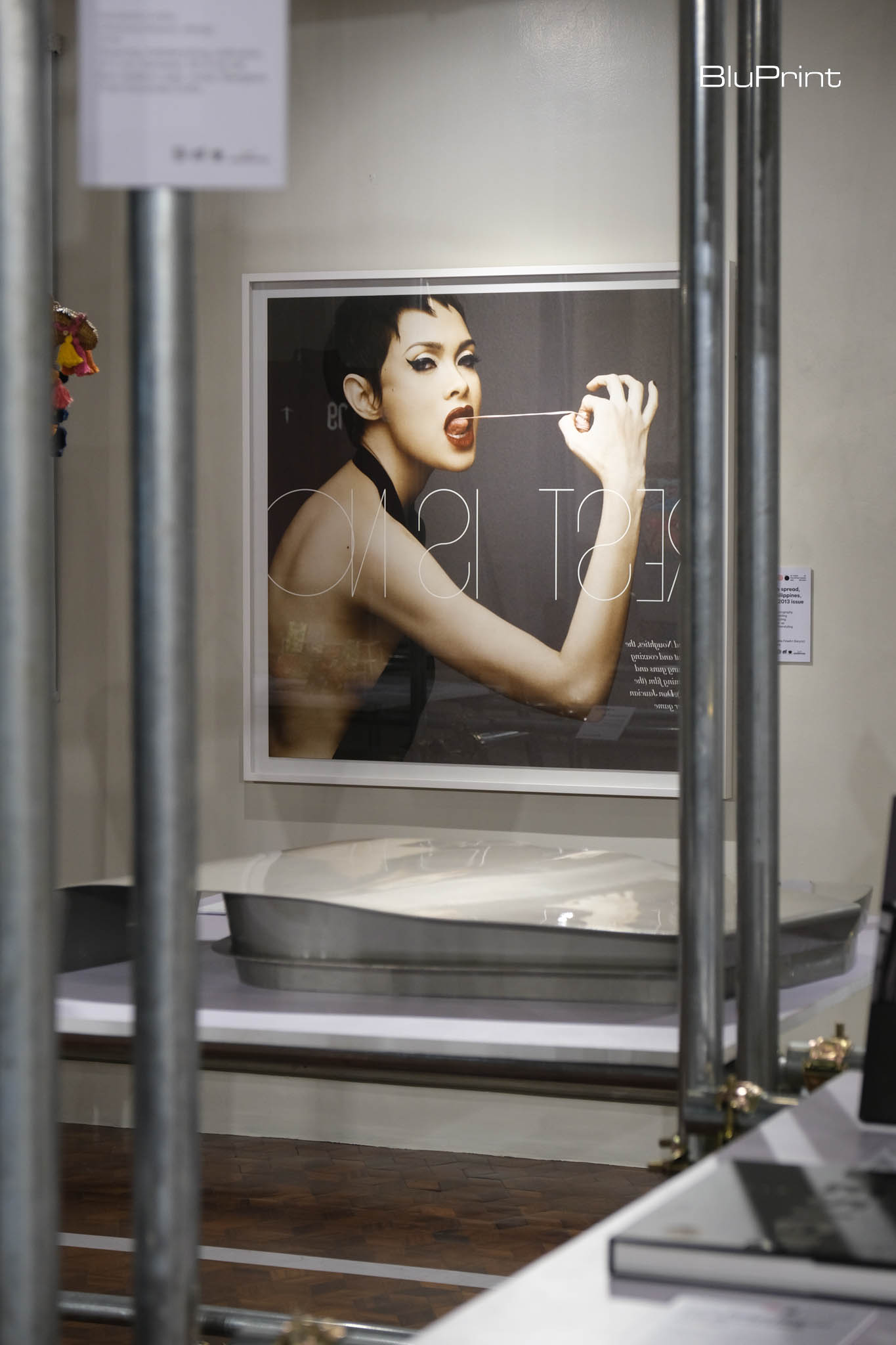 Photograph by Mark Nicdao of a model pulling her gum