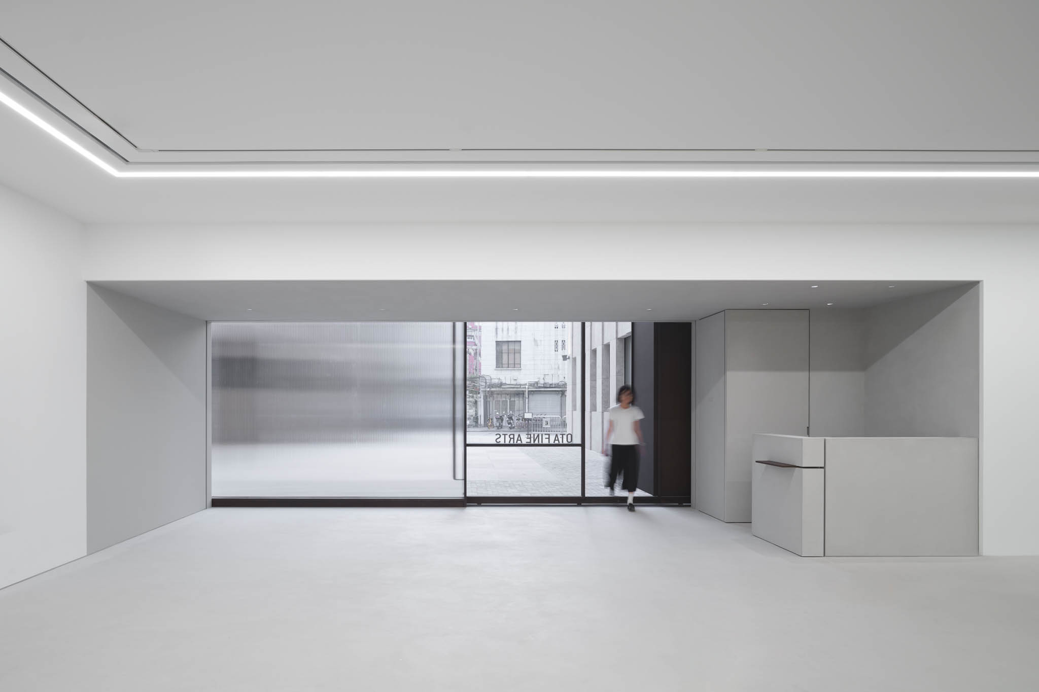 BluPrint-2023-December-IN-ARTICLE-(NERI AND NU)-08 - BluPrint A view of the all white minimalist interior looking into the building's inner courtyard