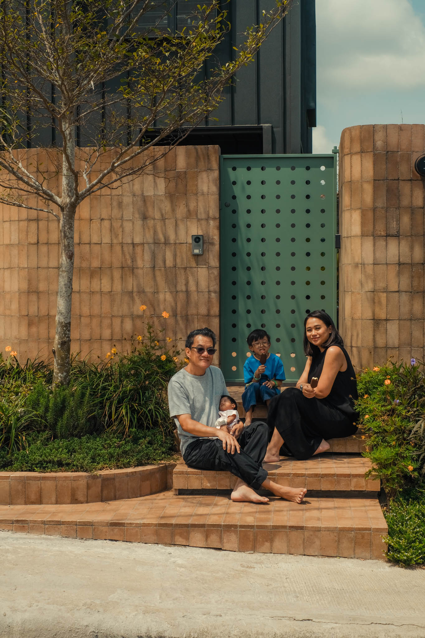 The Rojales family in front of their dream home in Tagatay.