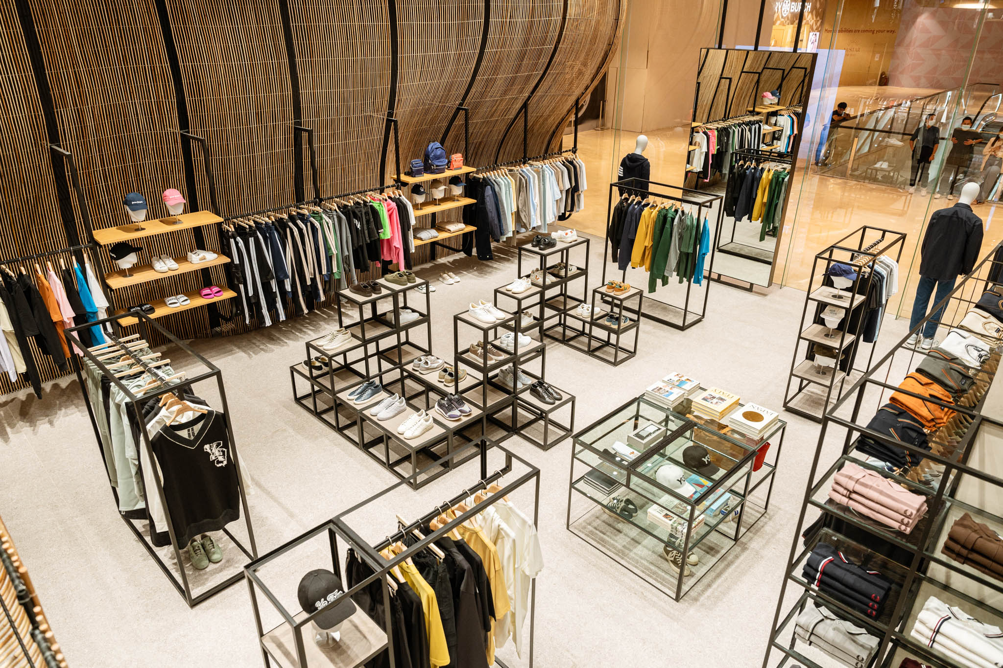 A top view of UNIVERS NUSTAR's retail space showcasing fashion items on sale.