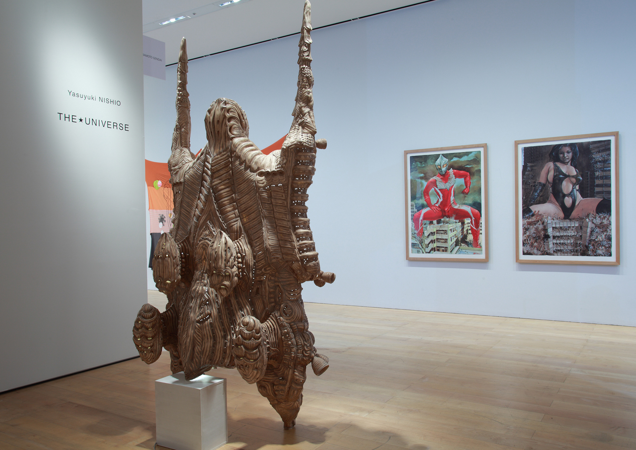 A sculpture depicting a headless creature with two legs and wings.