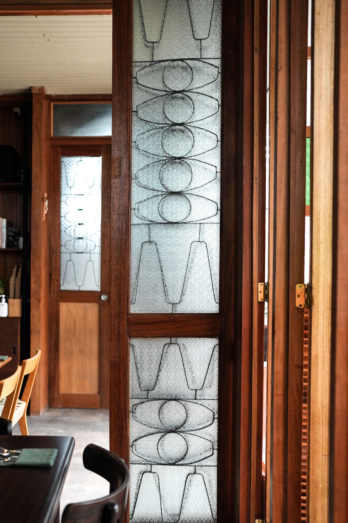 The architectural detail of a glass door at the Lark in San Juan, La Union.