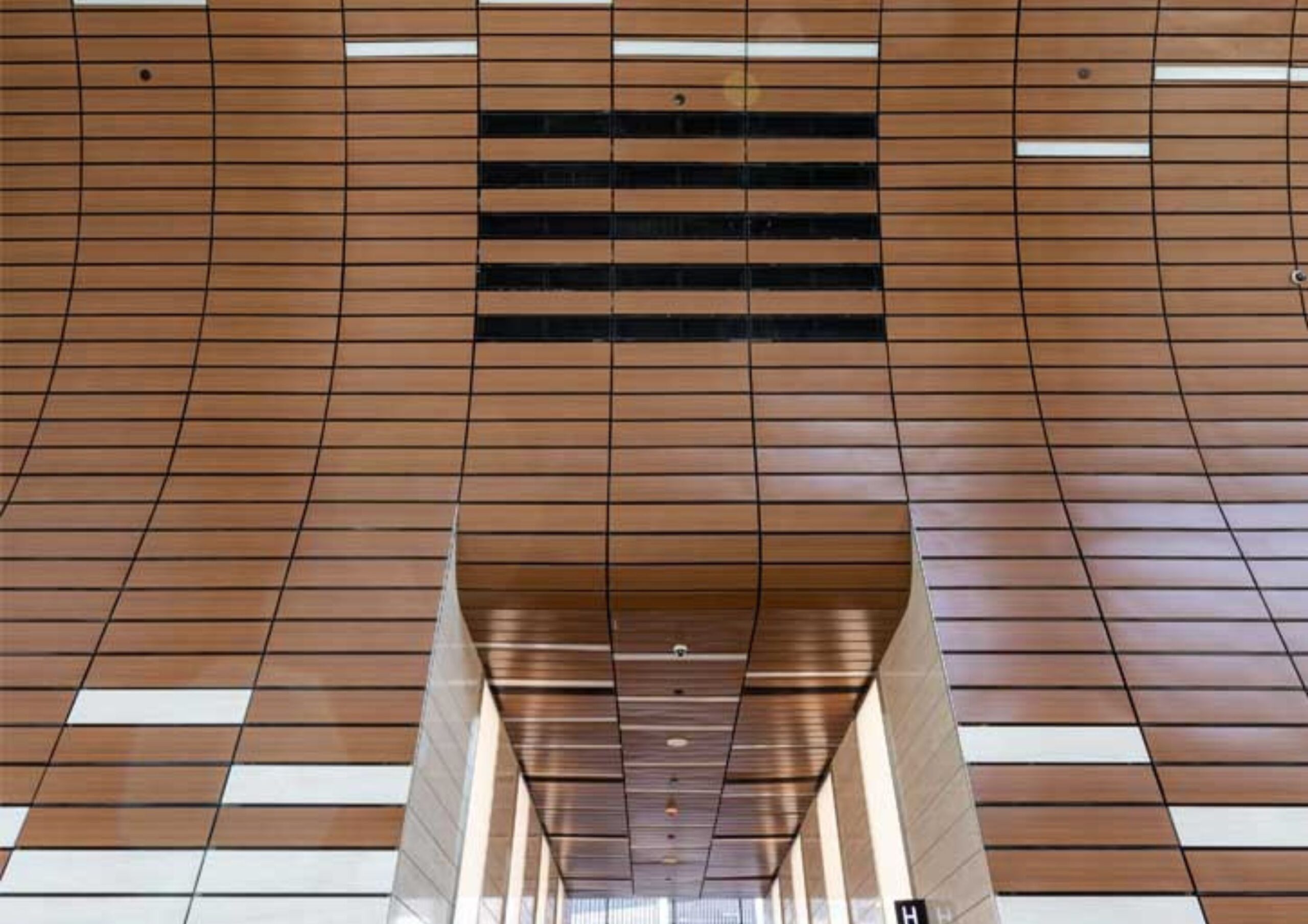 Parametric design applied to a feature wall in a building lobby.