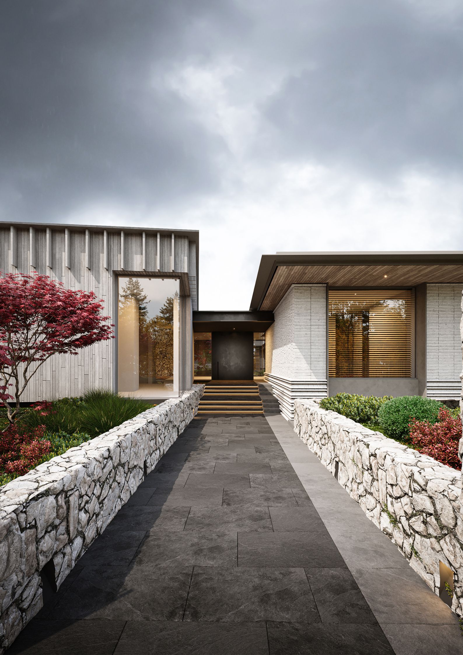 Dark stone tiles line the pathway leading to the front door. They provide a stark contrast to the lighter stone retaining walls on either side. An array of lush, colorful plantings fill the walls to add vibrancy and a touch of nature to the approach.