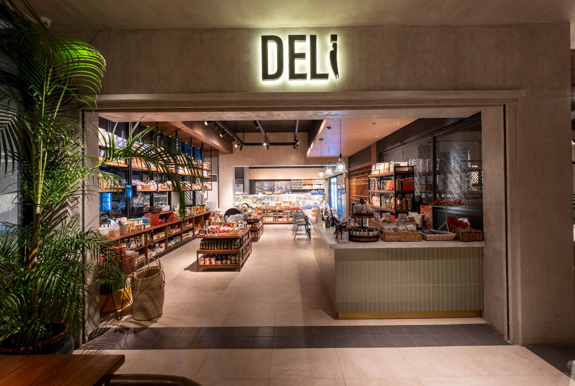 Cafe Bobs Deli designed by Larawan Ink in Bacolod, with shelves packed with goods.