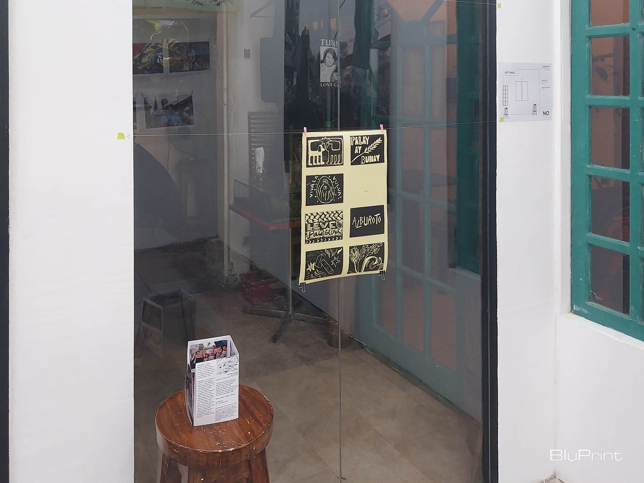 A poster and a zine exhibited during "Alburoto." Photo by Elle Yap.