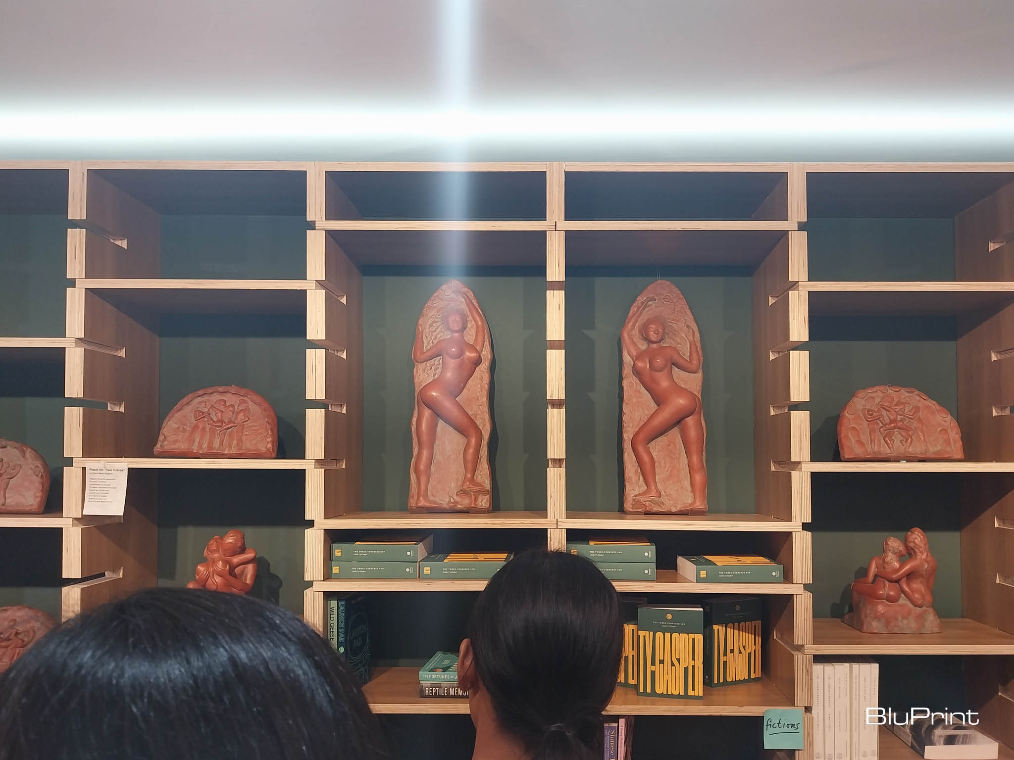 Sculptures as posed in the bookshelves. Photo by Elle F. Yap