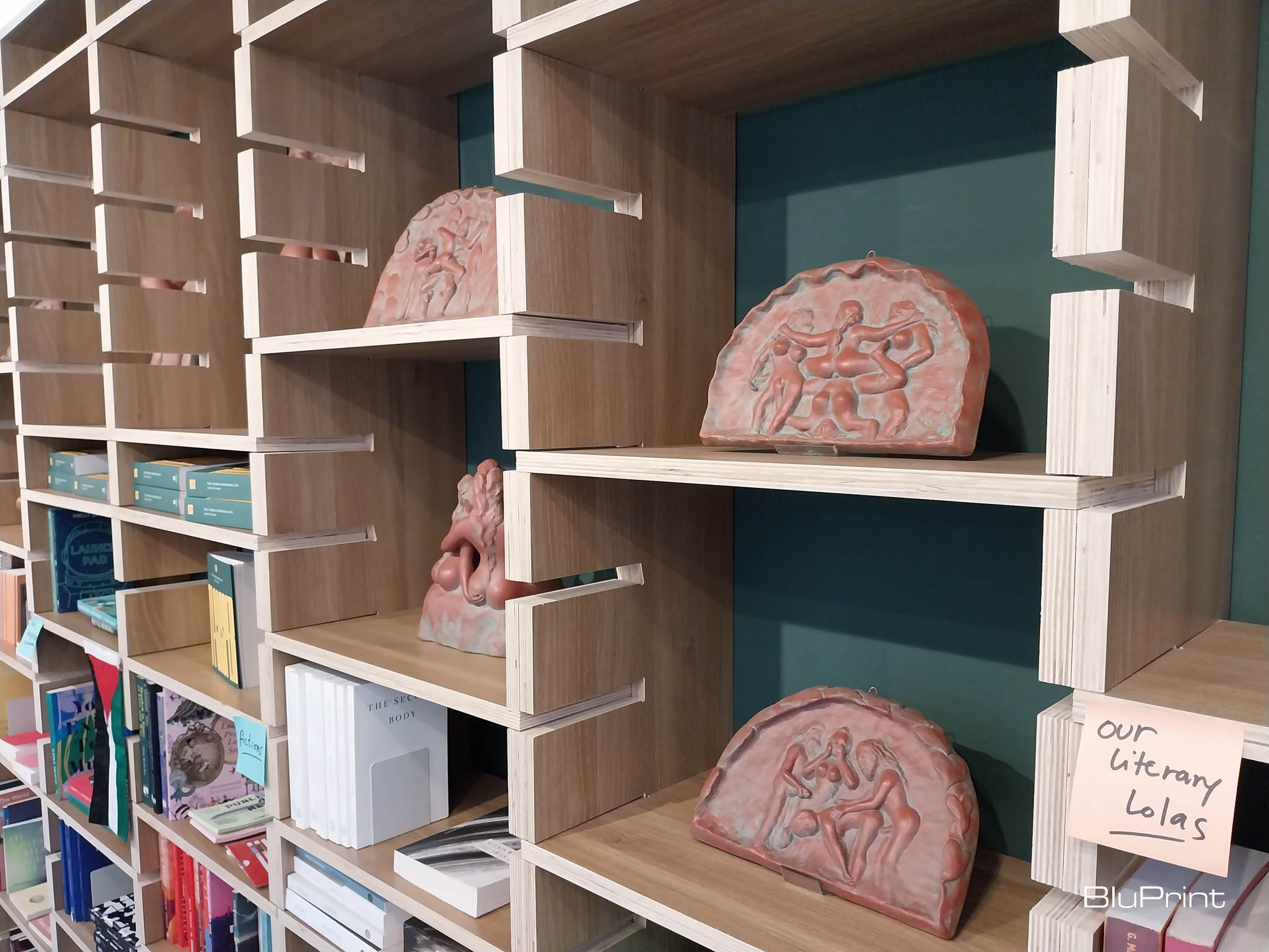 Sculptures as presented in the bookshelves for Agnes Arellano's exhibit. Photo by Elle Yap.