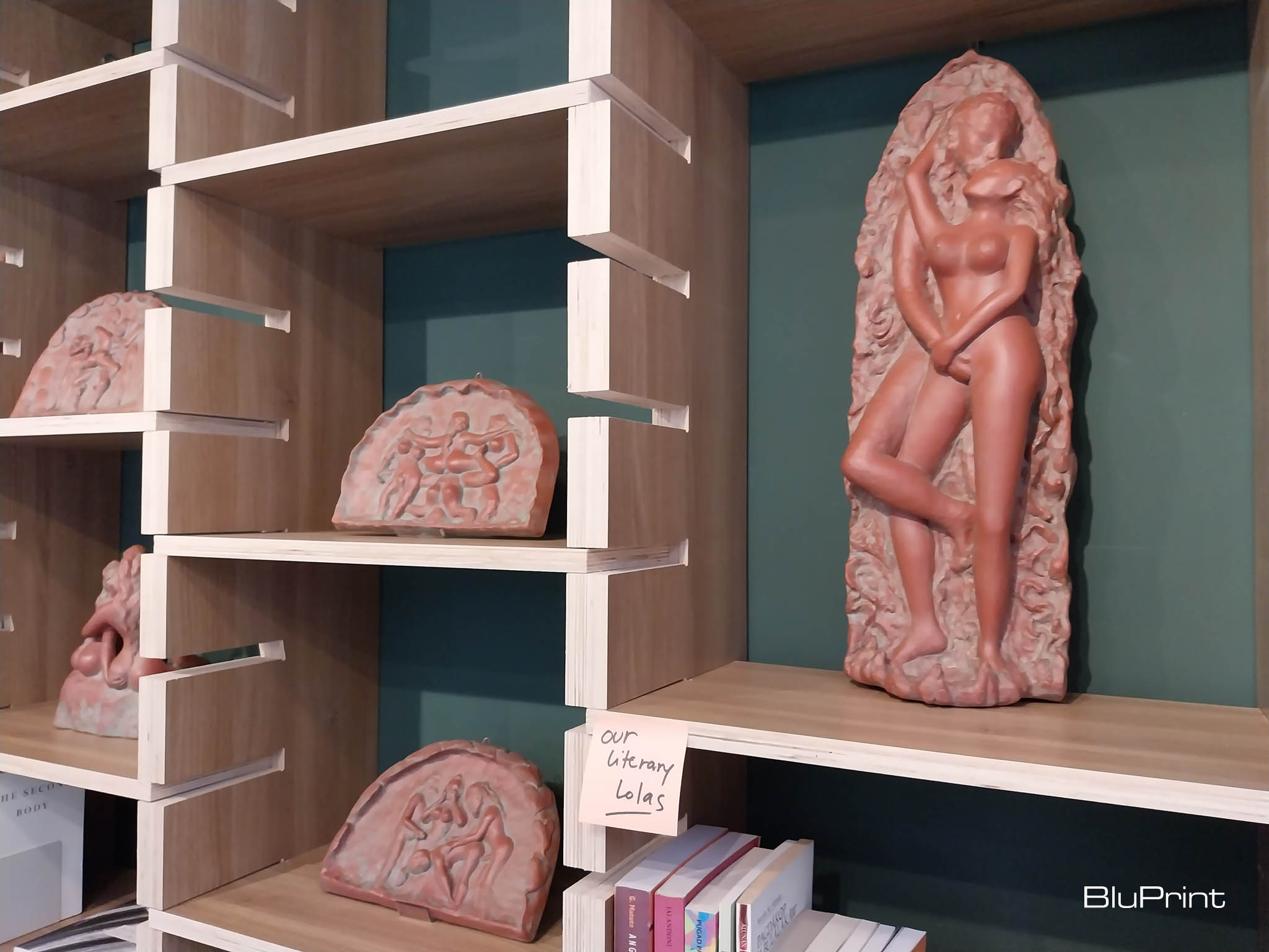 Some of the works as presented in the bookshelves for Agnes Arellano's exhibit. Photo by Elle Yap.