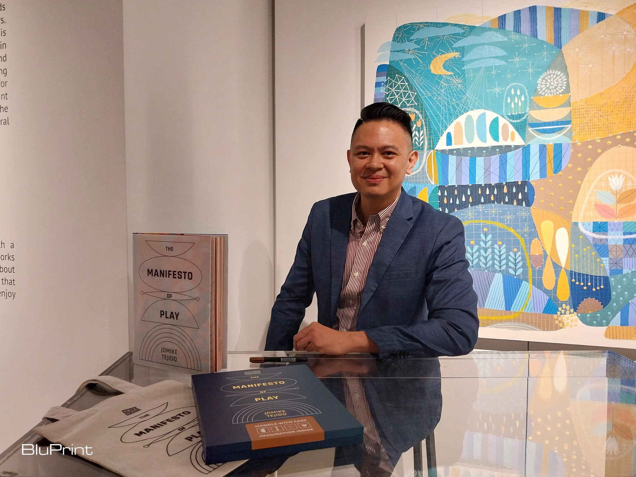 Jomike Tejido with his new book. Photo by Elle Yap.