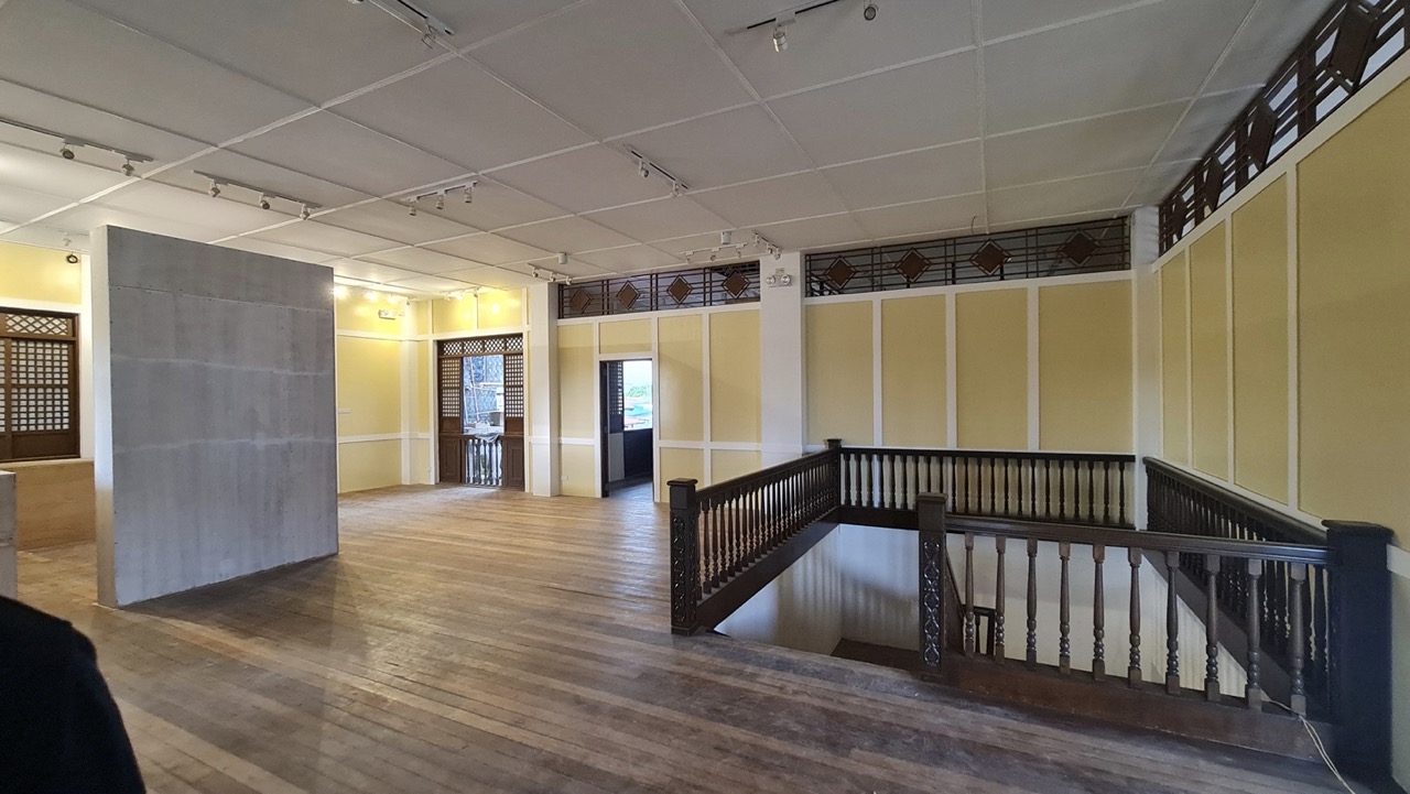The exhibit area of Dr. Pio Valenzuela's bahay na bato, now a museum, with light yellow walls, and hard wood floors.