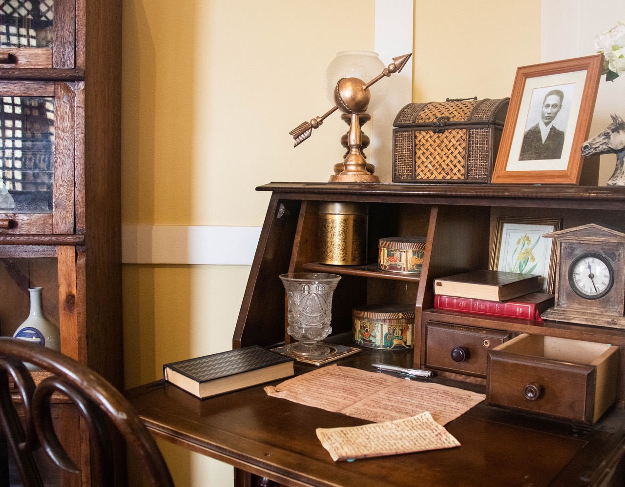 A traditional wooden desk and chair in Dr. Pio Valenzuela's bahay na bato, now a museum.