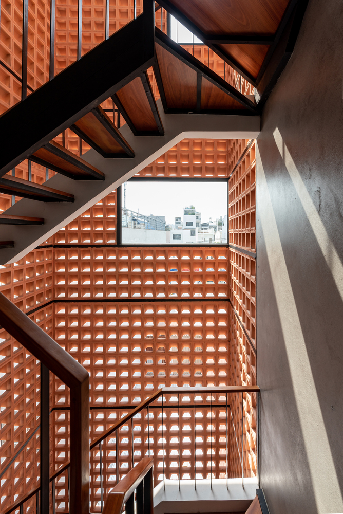 a modern stairway with wind blocks inside a modern tiny house design.