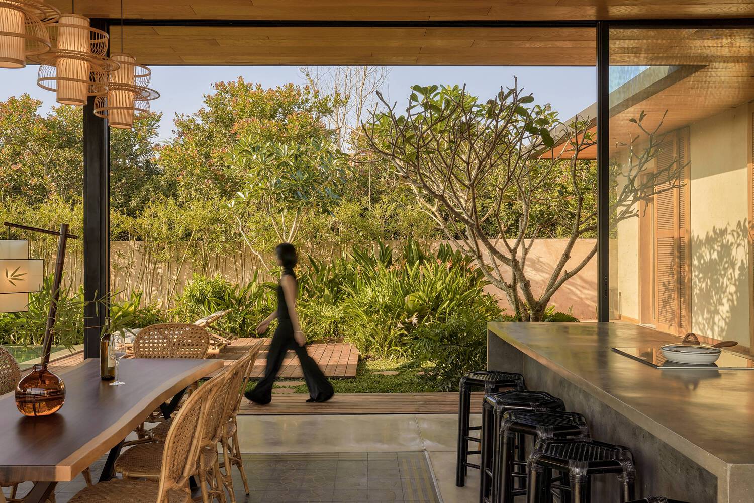 Person walking by kitchen.
