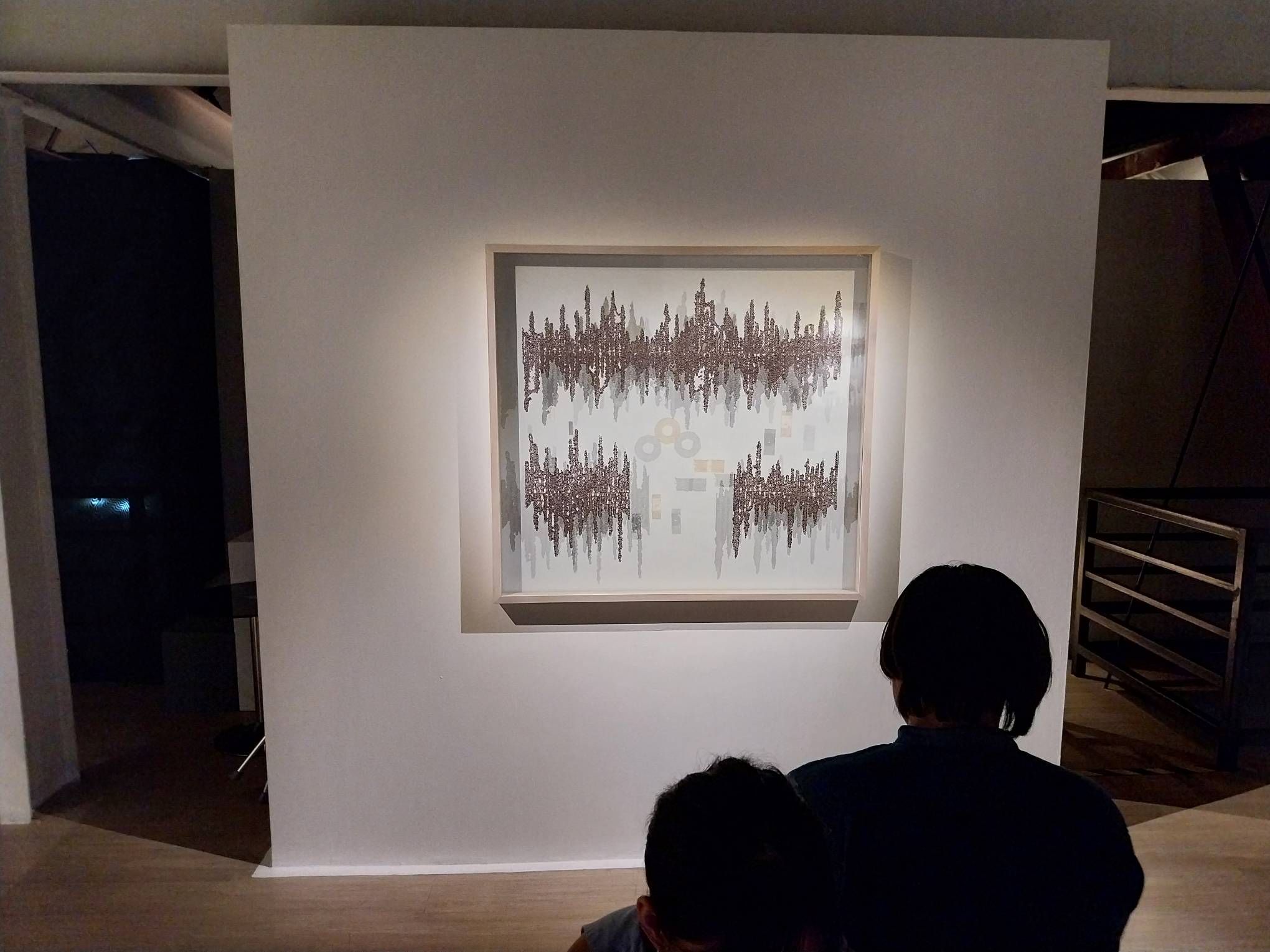 Someone looking at Julieanne Ng's work. Photo by Elle Yap.