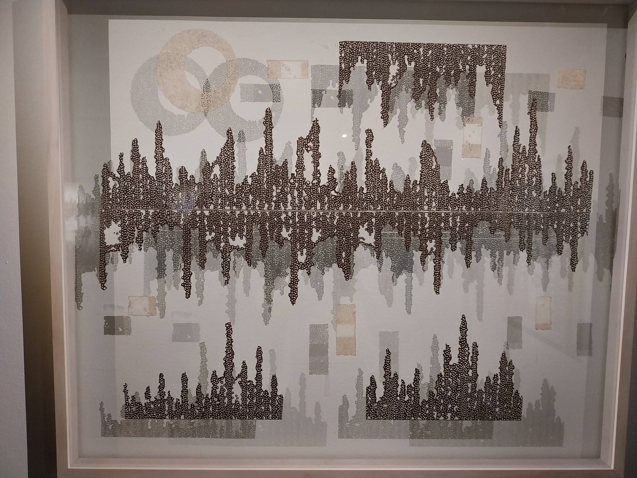 One of the works exhibited with shadows prominently adding to the painting. Photo by Elle Yap.