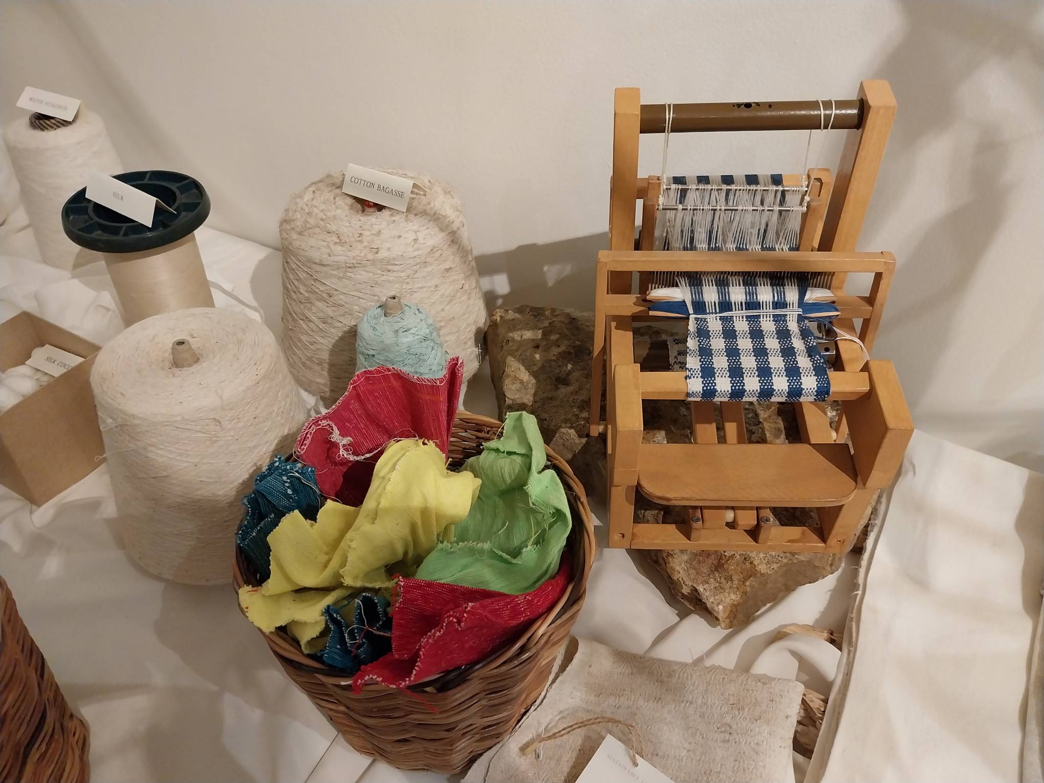 Small weaving loom with threads on the side. Photo by Elle Yap.