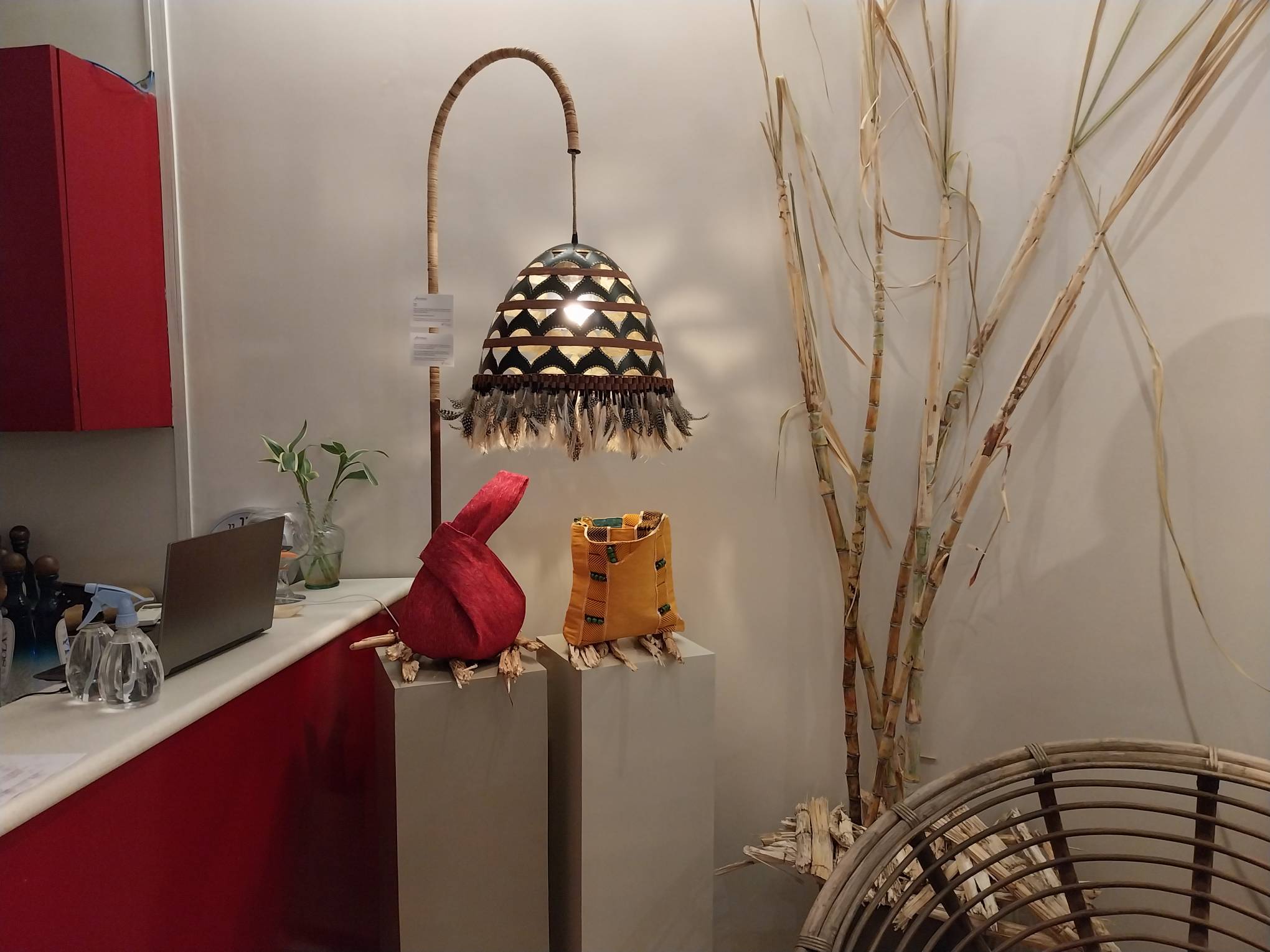 Two bags from Kanya displayed under a lamp. Photo by Elle Yap.