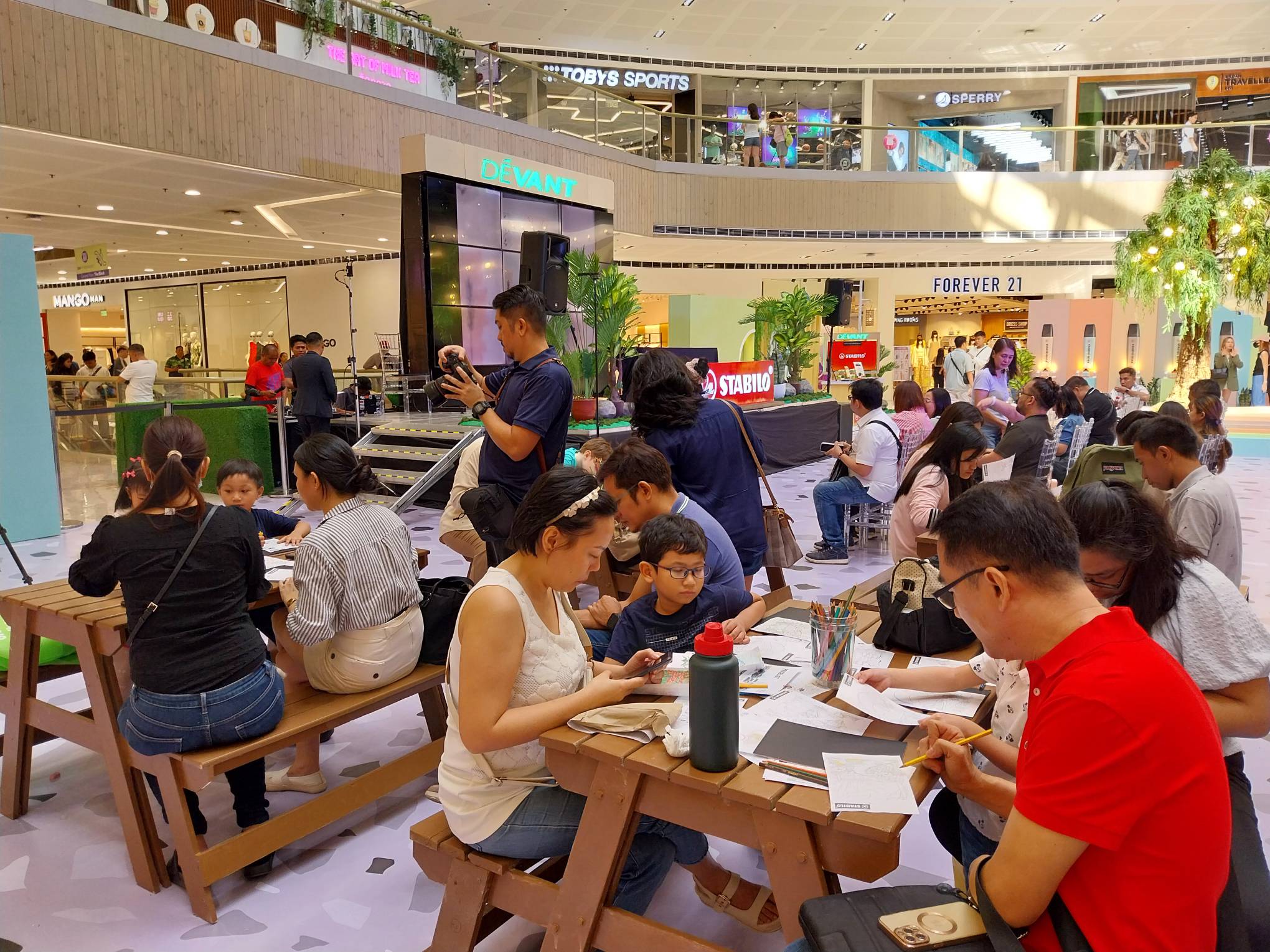 Families in the task of making art. Photo by Elle Yap.