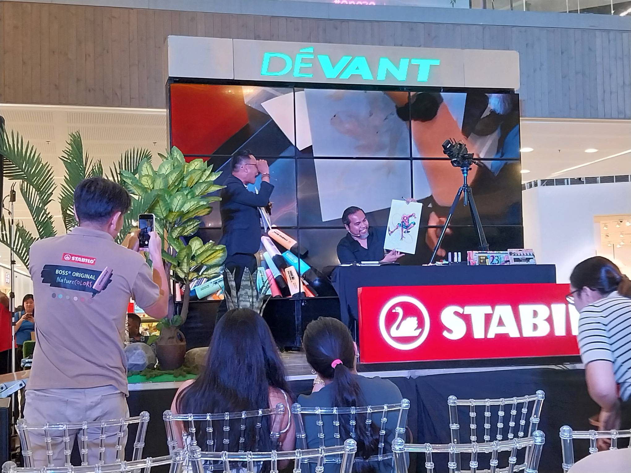 Comic book artist Harvey Tolibao showing off his Spider-Man sketch. Photo by Elle Yap.