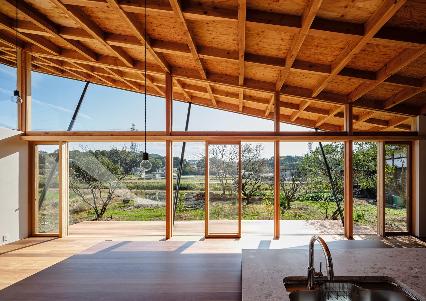 A view of the interior with the sloping roof. Photo by Takashi Uemura.
