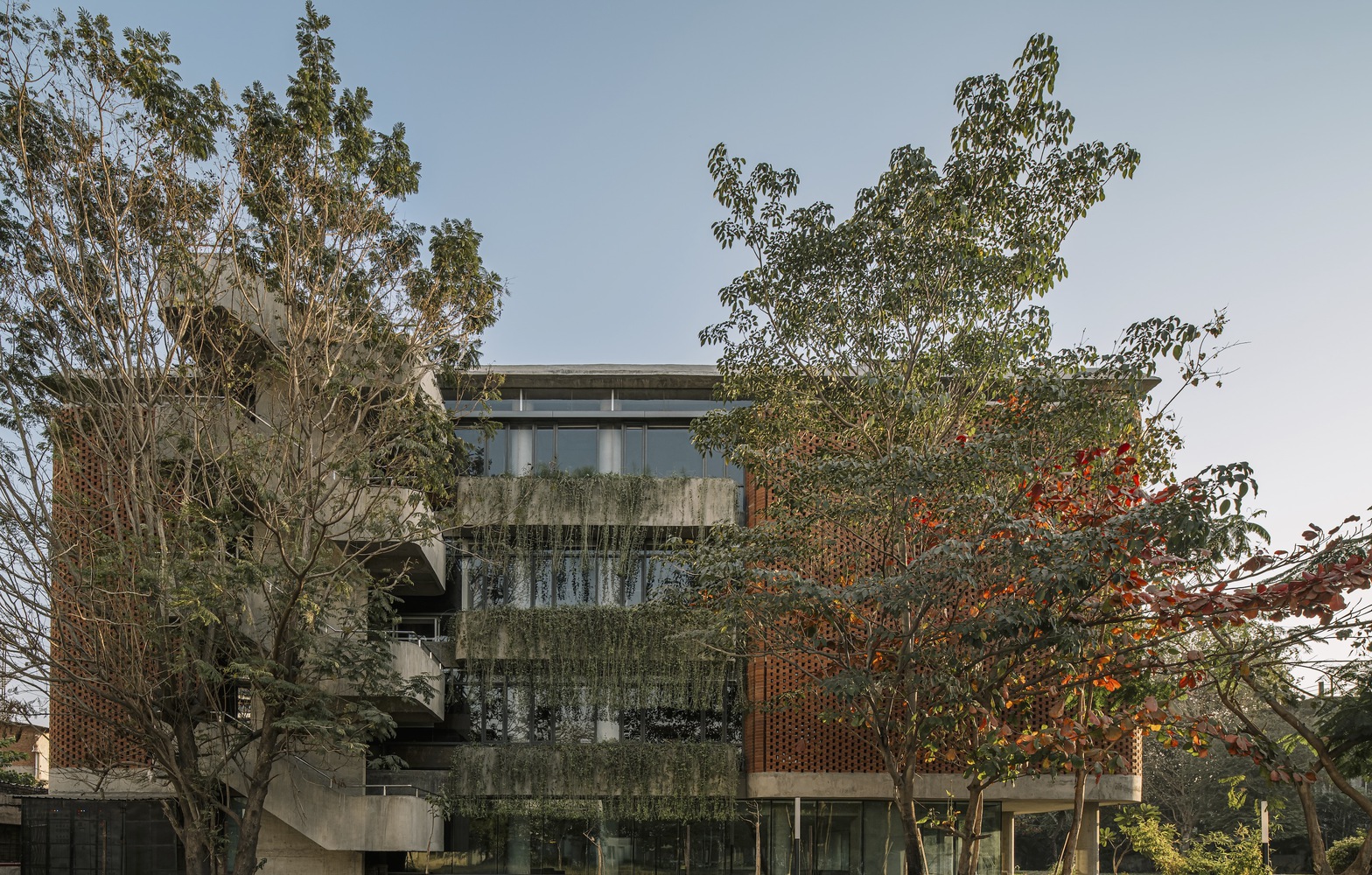 Side view of the Nursing College Ashaktashram with plants. Photo by The Fishy Project.