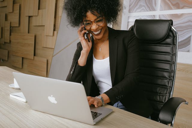 Woman working on a computer desk. Photo by Anna Shvets. Source: Pexels.