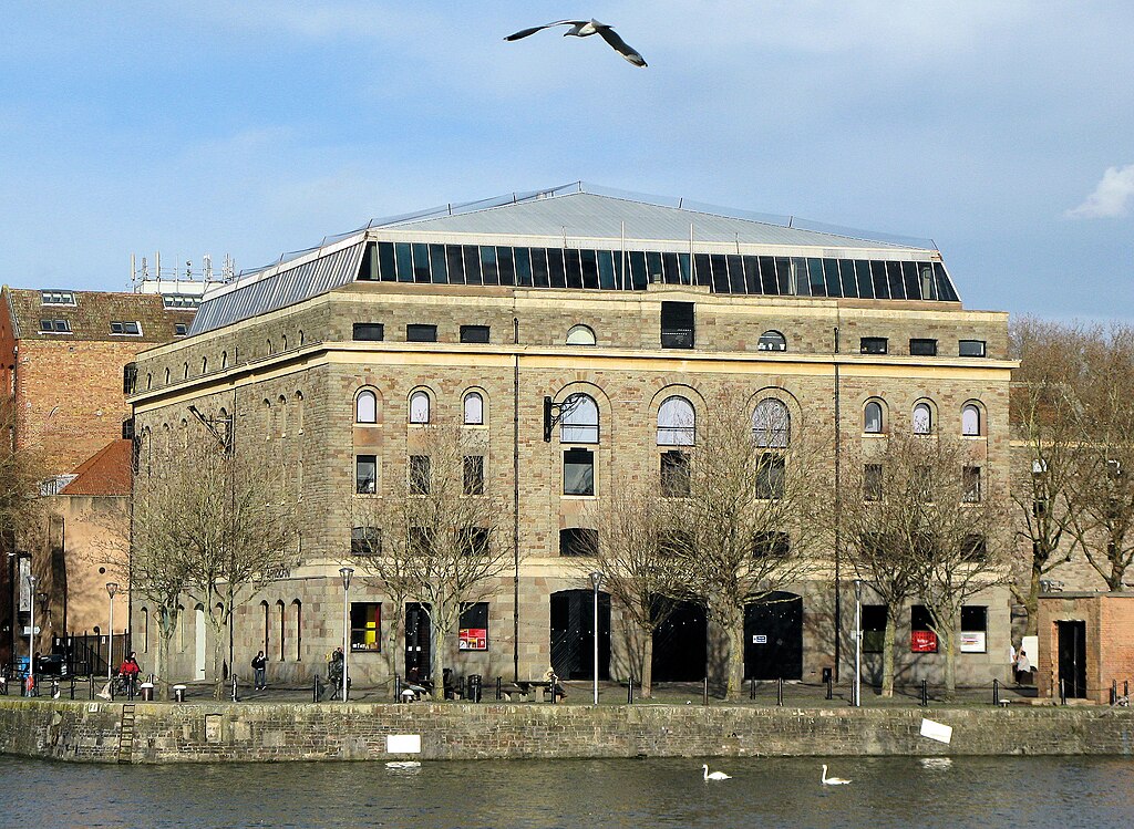 1024px-Arnolfini_from_across_the_harbour_arp - BluPrint Arnolfini from across the harbor. Photo by Arpingstone. Source: Wikimedia Commons.