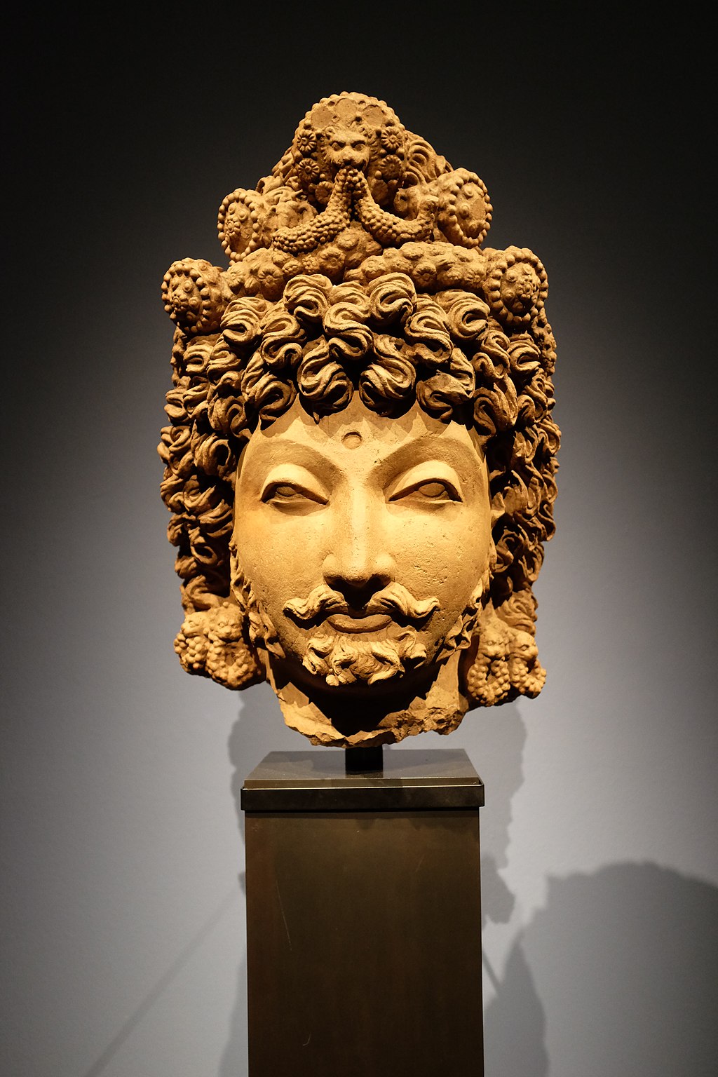 A Gandharan headpiece from Pakistan, akin to the trafficked antiques of Subhash Kapoor. Photo by Jnzl's Public Domain Photos. Source: Wikimedia Commons. 