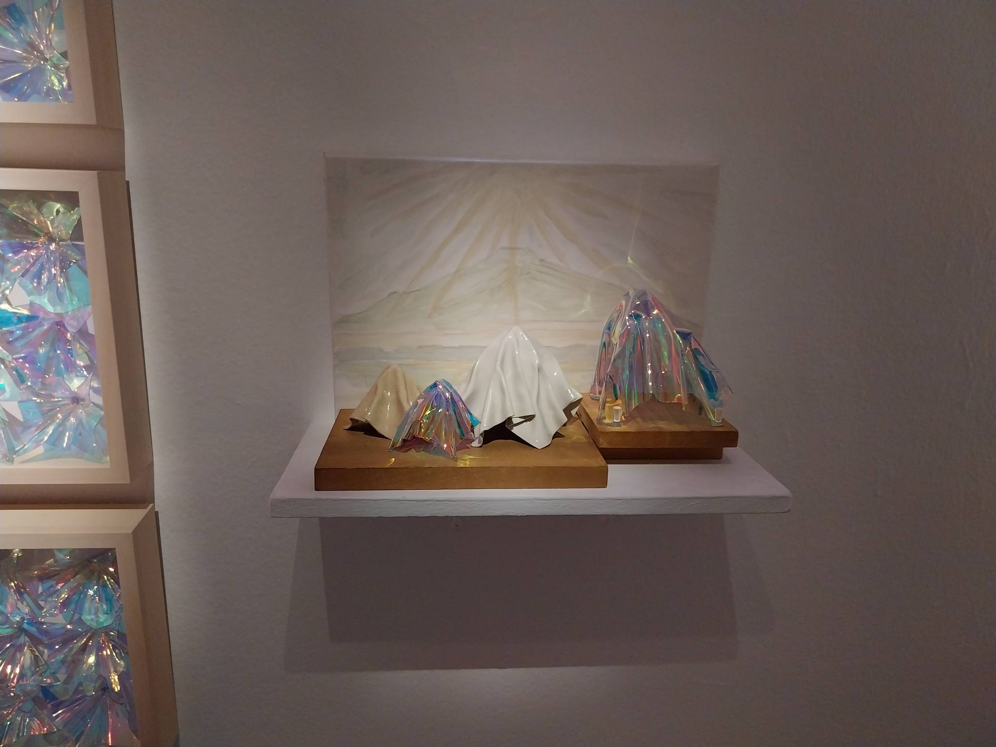 Some of the light filters with a drawing of a mountain behind them. Photo by Elle Yap.