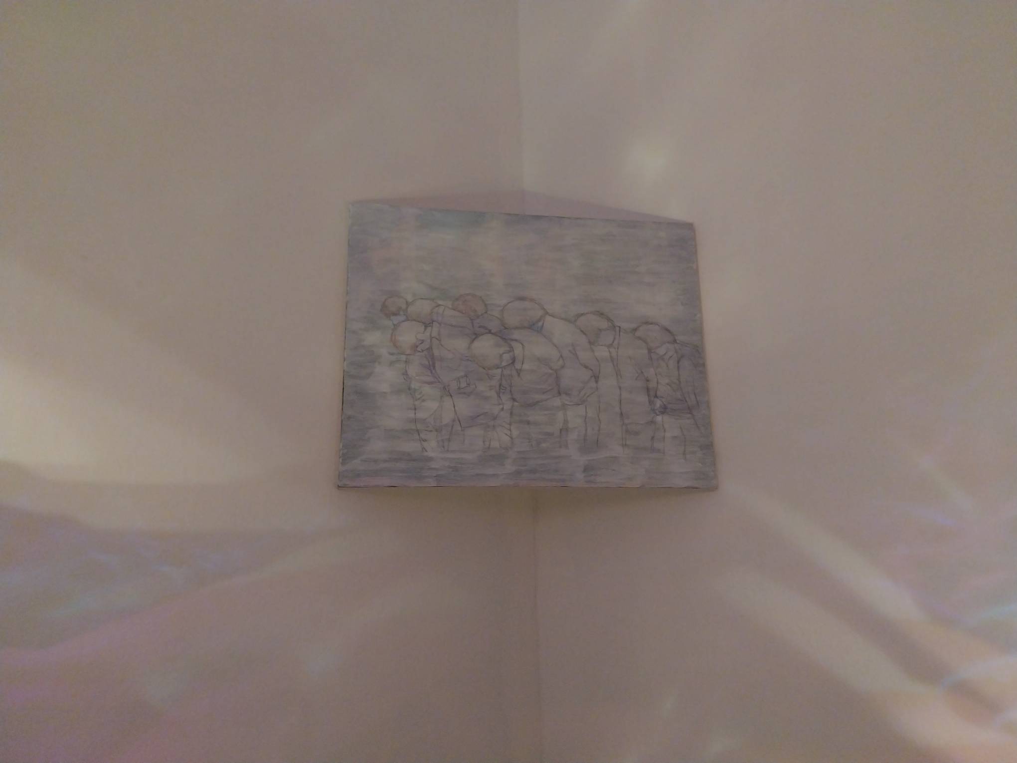 Koki Lxx's sketch of people with their heads low. Photo by Elle Yap.