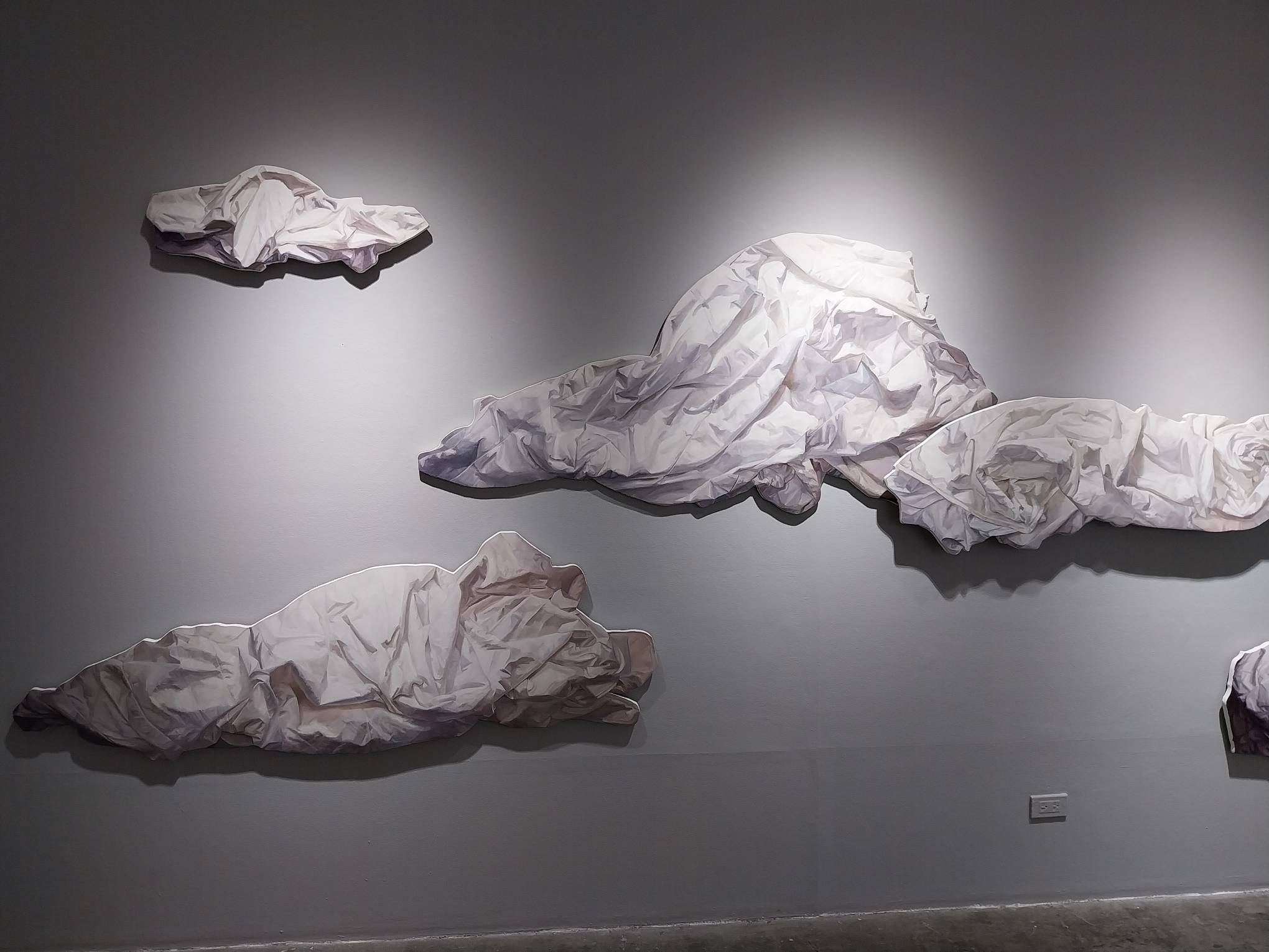 Three paintings for "Anecdotal Evidence." Photo by Elle Yap.